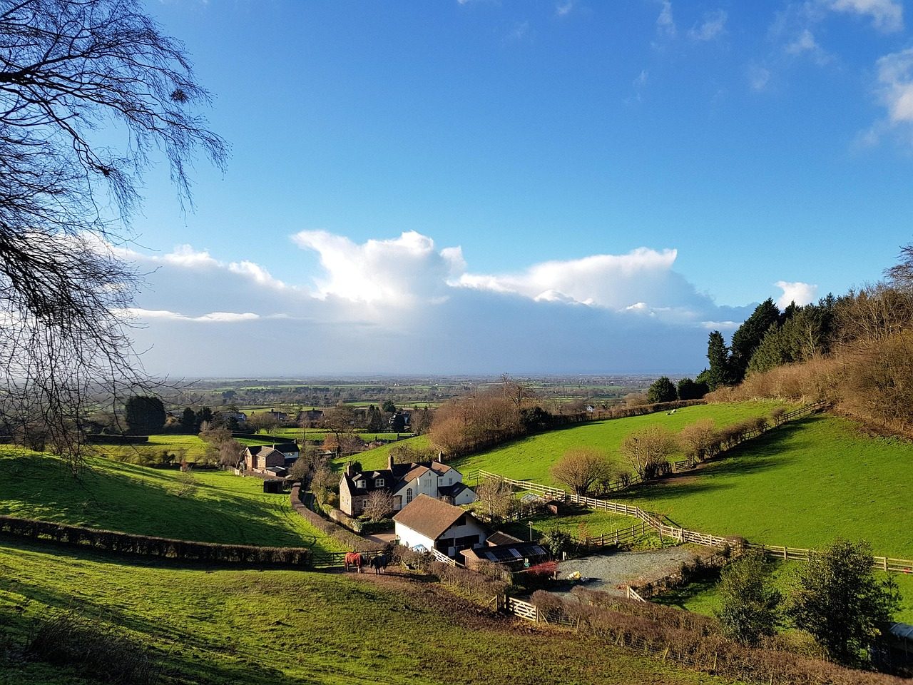 Cheshire fields and farmhouses under low winter sun, south of Warrington